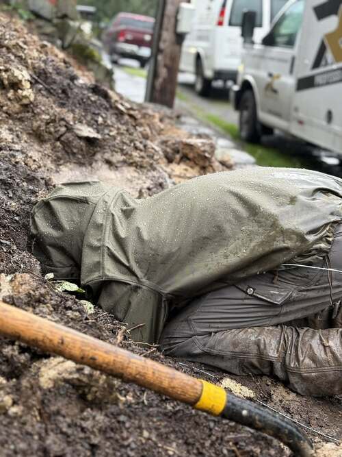 plumber working on a main water line